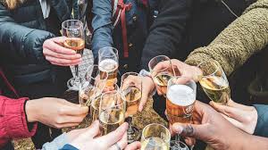 hands holding beer and wine glasses